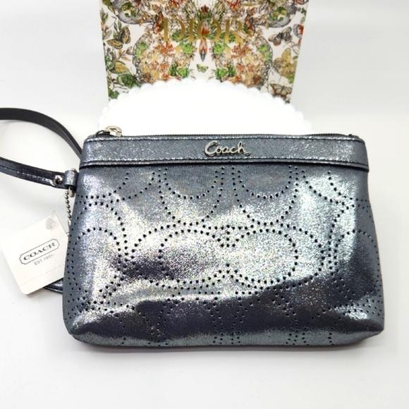 Coach NWT Metallic Silver Perforated Kissing "Cs" Wristlet - Picture 1 of 5